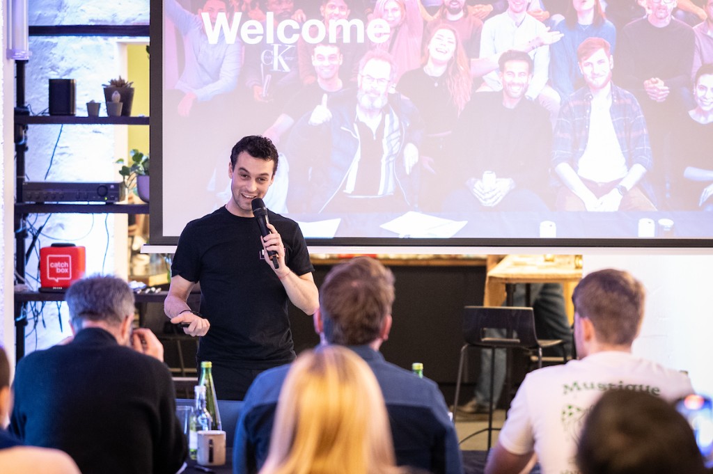 Presenter welcoming attendees at a workshop session